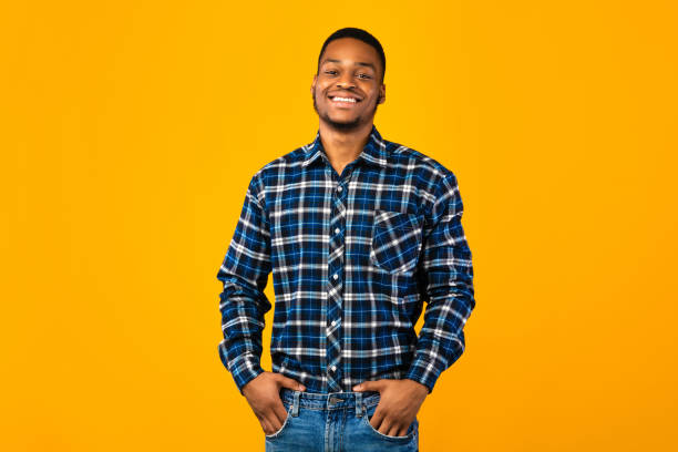 istock African Guy Posing Holding Hands In Pockets Over Yellow Background 1271724009