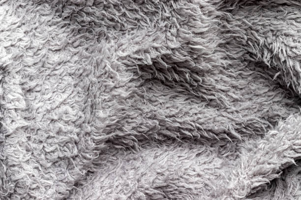 istock Gray fluffy fabric background. Warm sweater texture 1271724014