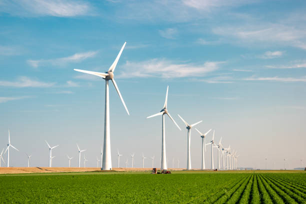 istock offshore windmill park with stormy clouds and a blue sky, windmill park in the ocean 1271724486