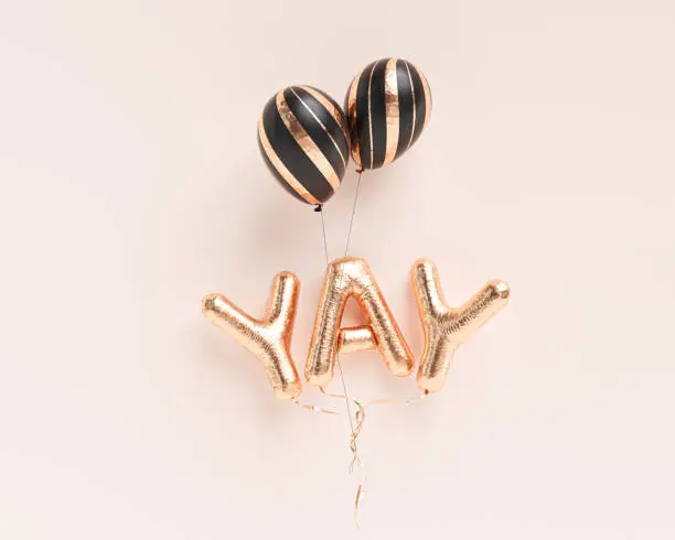 Photo of YAY word, foil balloon letters, festive happy and joy banner background. 3d rendering