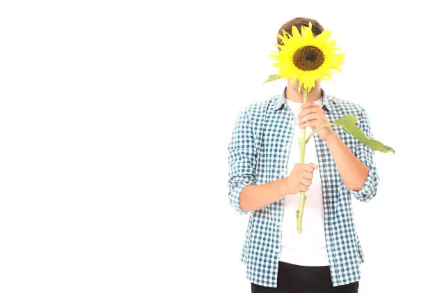 Photo of Young man with sunflower isolated on white. Mock up and copy space. Mothers day