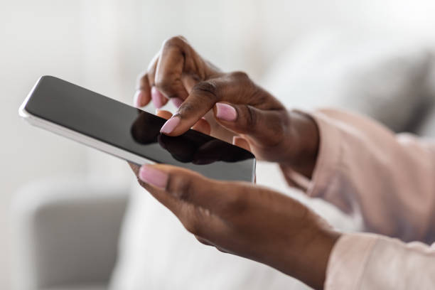 istock Unrecognizable African Woman Using Smartphone With Blank Black Screen, Mockup Image 1271730210