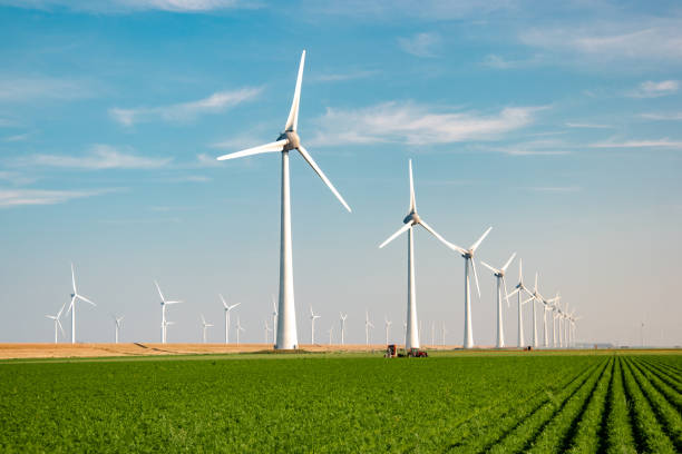 istock offshore windmill park with stormy clouds and a blue sky, windmill park in the ocean 1271730302