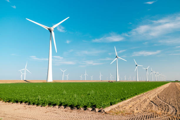 istock offshore windmill park with stormy clouds and a blue sky, windmill park in the ocean 1271730371