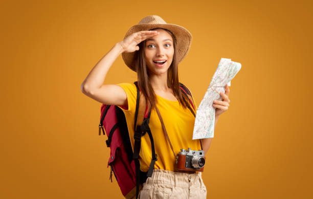 istock Amazed girl hiker with map doing sightseeing 1271730930