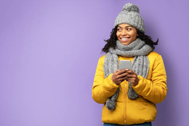 istock Happy Black Girl Using Smartphone Posing Over Purple Background 1271730977