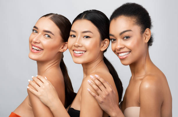 istock Three Mixed Girls Posing Shirtless, Wearing Bra, Studio Shot 1271731180