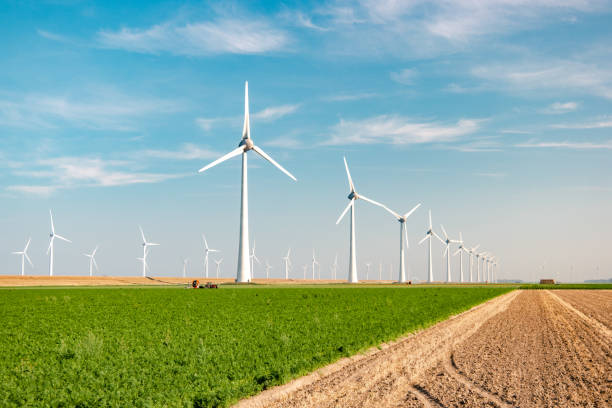 istock offshore windmill park with stormy clouds and a blue sky, windmill park in the ocean 1271732109