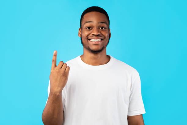 istock African Man Showing Number One Counting On Fingers, Studio Shot 1271734228