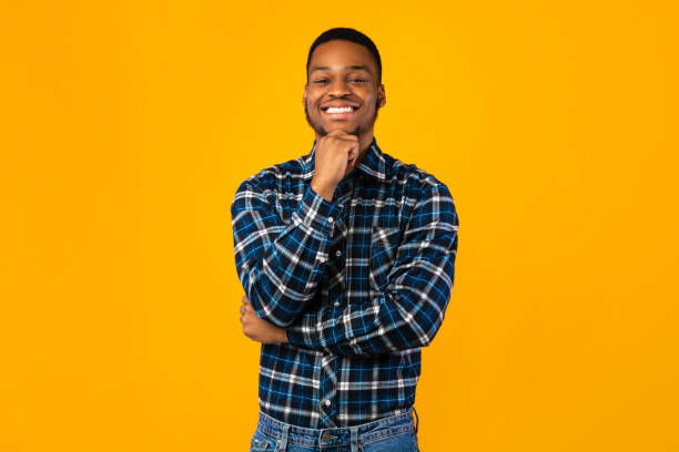 istock Positive African Millennial Guy Posing Smiling To Camera, Studio Shot 1271736204
