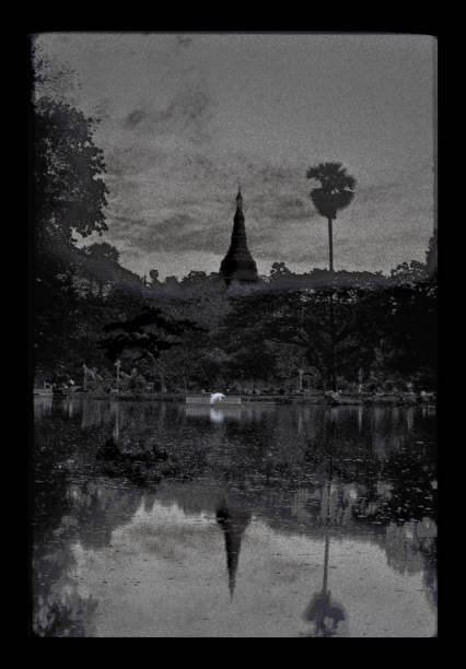 Trip to Myanmar 1997 A view of the Shwedagon pagoda, Yangon, from across a lake. shwedagon pagoda photos stock pictures, royalty-free photos & images