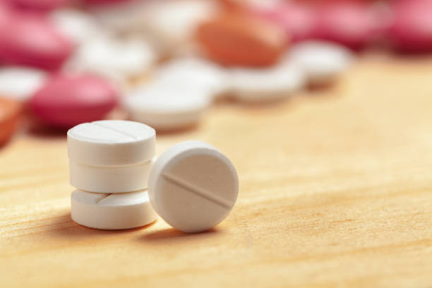 istock Assorted pharmaceutical medicine pills, tablets on wooden background 1271737031