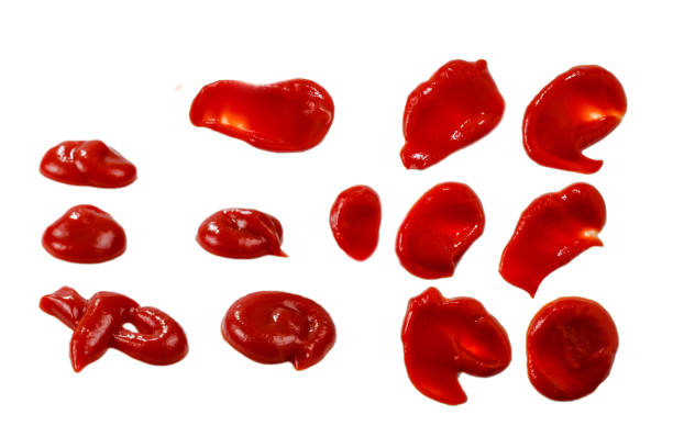istock Red sauce splashes isolated on white background. Ketchup. 1271738199