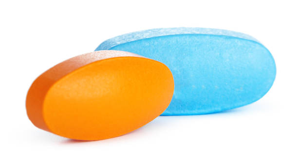 istock colorful pills isolated on white. creative photo. 1271738814