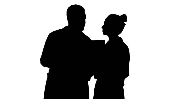 istock Silhouette Serious nice woman doctor and afro american doctor study brain x ray 1271739528