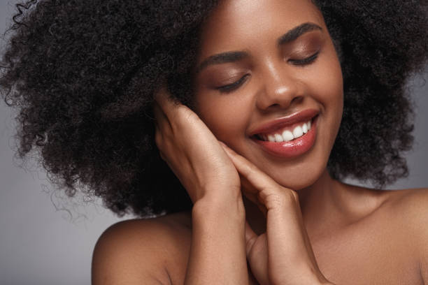 istock Glad African lady enjoying skin softness 1271739699