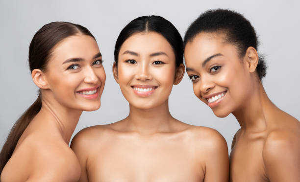istock Three Gorgeous Girls Models Posing Naked Standing Over Gray Background 1271739827