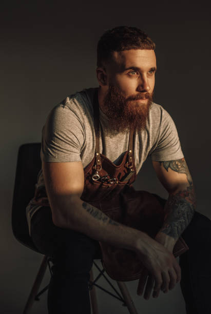 istock Thoughtful stylist sitting on chair 1271739883
