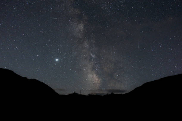 istock Starry sky and milky way in the mountains. 1271739893