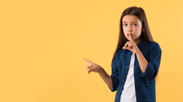 istock Girl pointing finger aside at copy space 1271739965