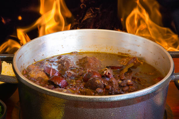 istock Feijoada. Traditional Brazilian food. Background with fire. 1271741890