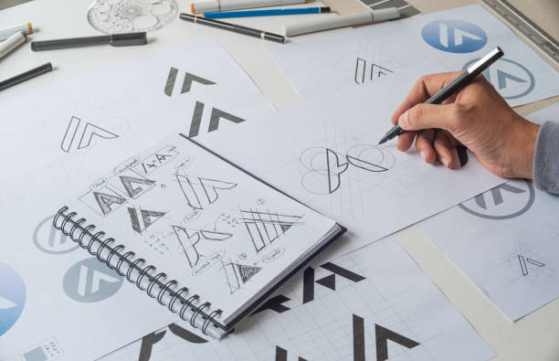istock Graphic designer creative design sketch drawing logo Trademark brand Workspace 1271742719