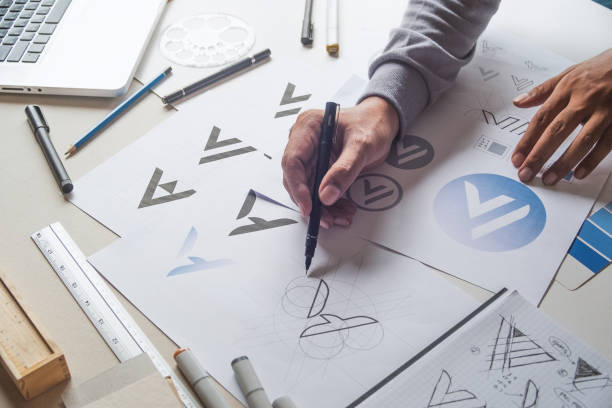 istock Graphic designer creative design sketch drawing logo Trademark brand Workspace 1271742720