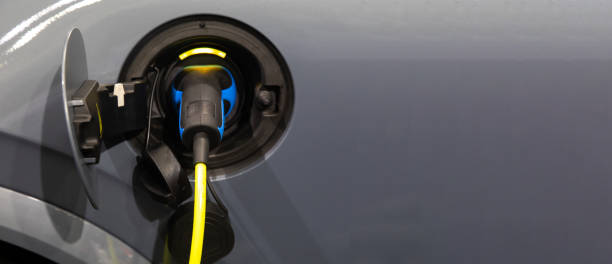 istock Power supply for electric car charging. Electric car charging station. Socket for electrical car battery charger. 1271746983