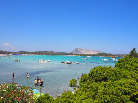 In August 2020, tourists were enjoying the beach of Lu Impostu near San Teodoro event with Covid-19, Sardinia.
