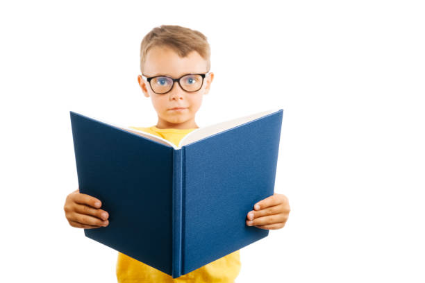 istock child reads a book against a bright wall 1271748377