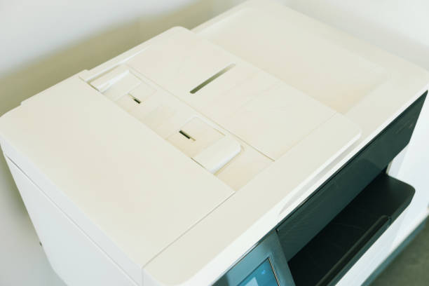 istock Close up photo of white printer machine in office 1271749454