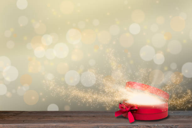 istock Red open glowing gift box with magic light rays and stars. Christmas backgrounds. 1271749477