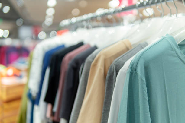 istock Colorful clothes hanging on a hanger in a store 1271749810