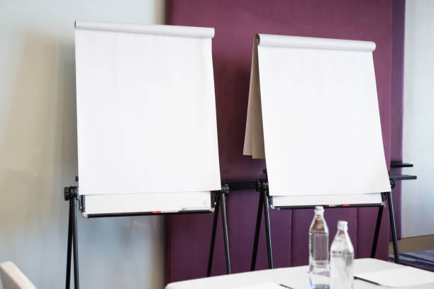 Papers realistic blank flipchart with legs on white paper background or roll up for presentation in meeting corporate training briefing or lecture classroom in university Papers realistic blank flipchart with legs on white paper background or roll up for presentation in meeting corporate training briefing or lecture classroom in university flipchart stock pictures, royalty-free photos & images