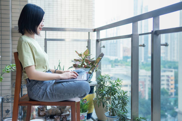istock A freelancer works with a laptop on a balcony at home 1271750243