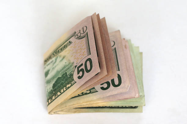 istock Wad of $50 & $20 Dollar notes 1271752696