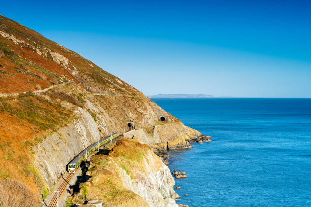 istock Train exiting a tunnel. View from Cliff Walk Bray to Greystones, Ireland 1271753094