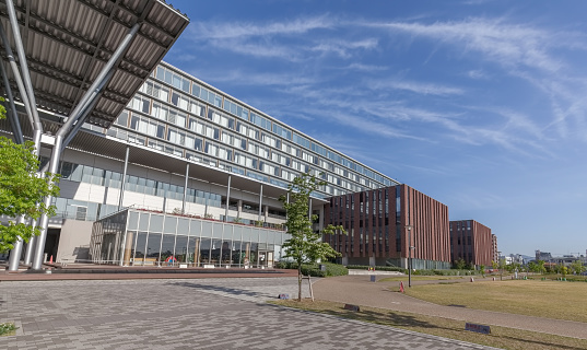 Osaka, Japan - May 12, 2020: Ritsumeikan University Osaka Ibaraki campus buildings and Iwakura park in Ibaraki city