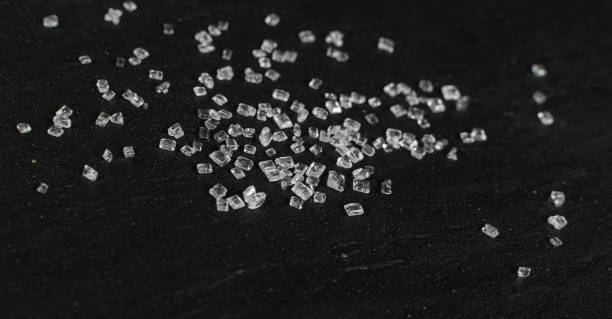 istock Big Sugar Crystals or Sucrose Crystals on Black Background 1271754333