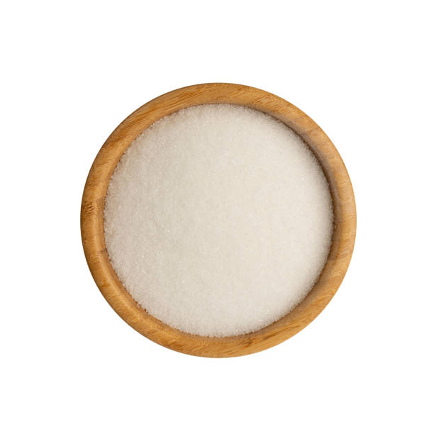 istock Small Crystals of White Sugar Isolated on White Background 1271754657