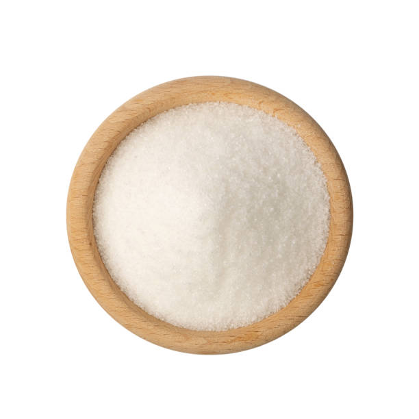istock Small Crystals of White Sugar Isolated on White Background 1271754659