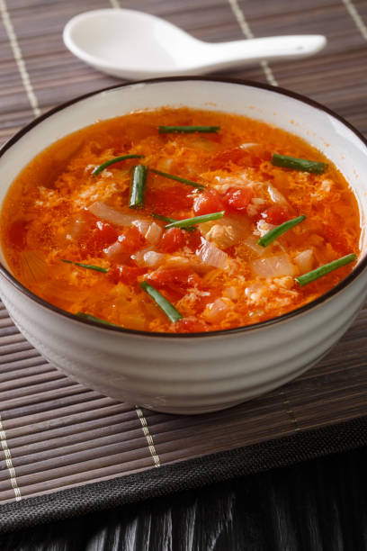 istock Chinese tomato egg drops soup close-up in a bowl. vertical 1271756032