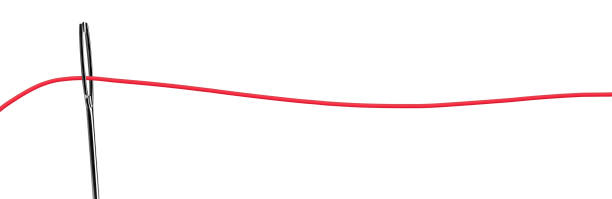 istock Red thread in the eye of the needle 1271756306