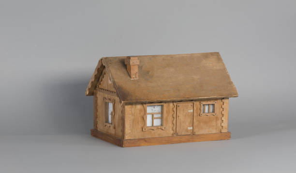 istock wooden house model isolated on gray background 1271757602