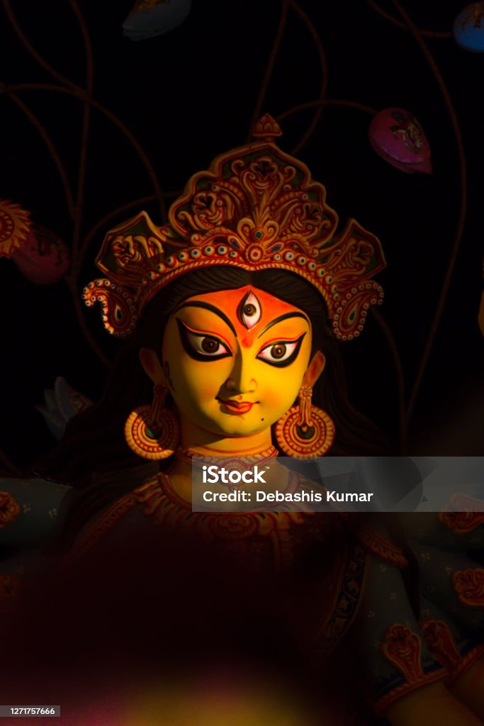 Portrait of Hindu Goddess Durga Portrait of Hindu Goddess Durga with spotlight on Her face Durga Puja Festival Stock Photo