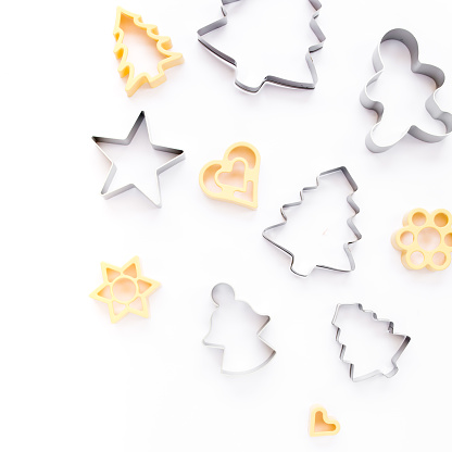 Christmas baking molds on white background. Flat lay, top view bakery composition. High quality photo