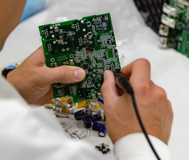 istock Technicians are using a soldering iron for repairing electronic of the electronic board. 1271758628