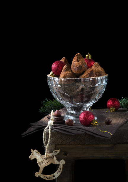istock Chocolate truffles covered in cacao powder and red baubles 1271761411