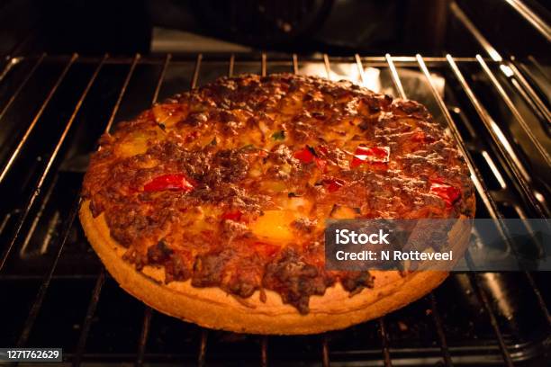 Tasty Home Made Pizza Just Out Of The Hot Oven Fast Food At Home Stock Photo - Download Image Now