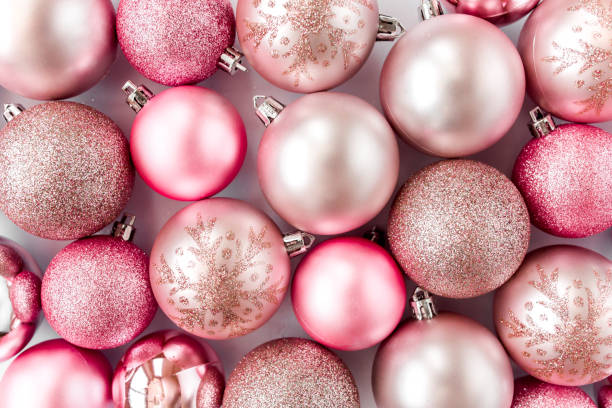 istock Christmas texture: pink glass christmas balls on white background. flat lay, top view 1271763403